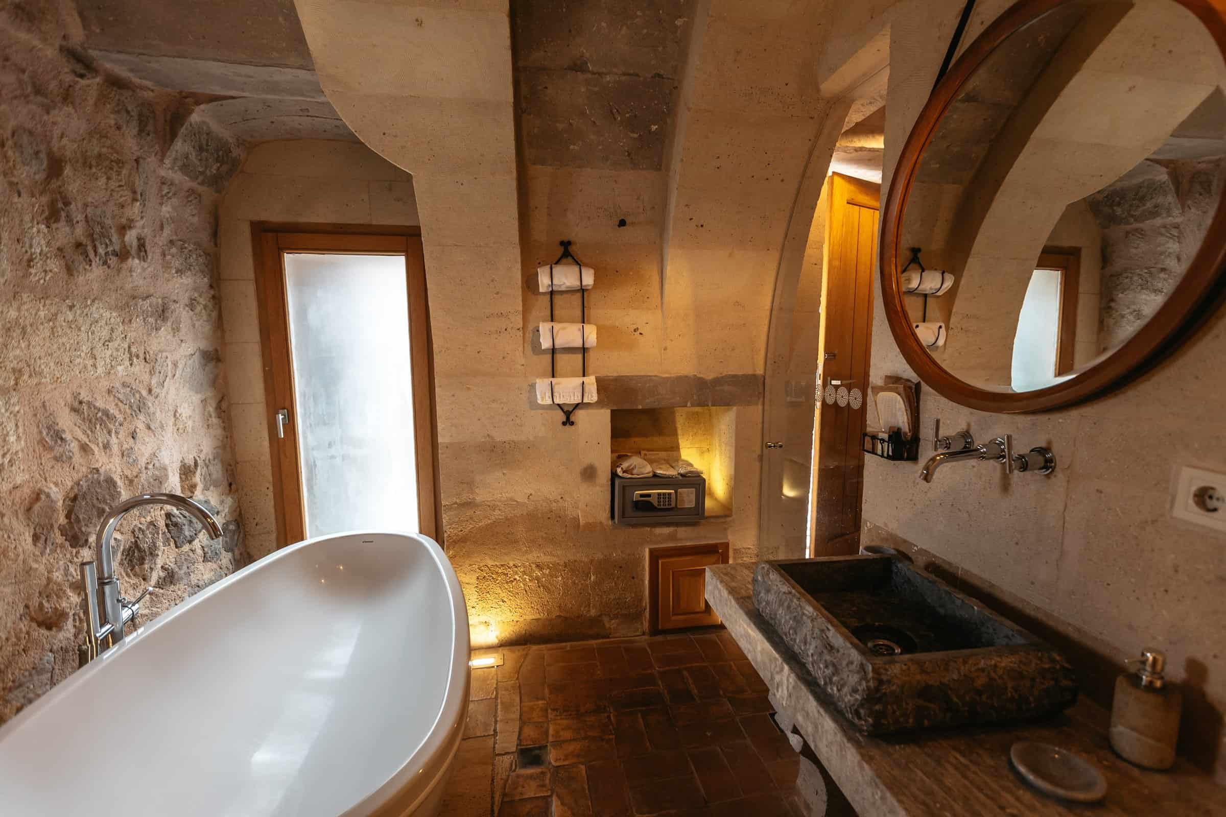 Bathroom with a bathtub in the Millstone Cave Suite standard room