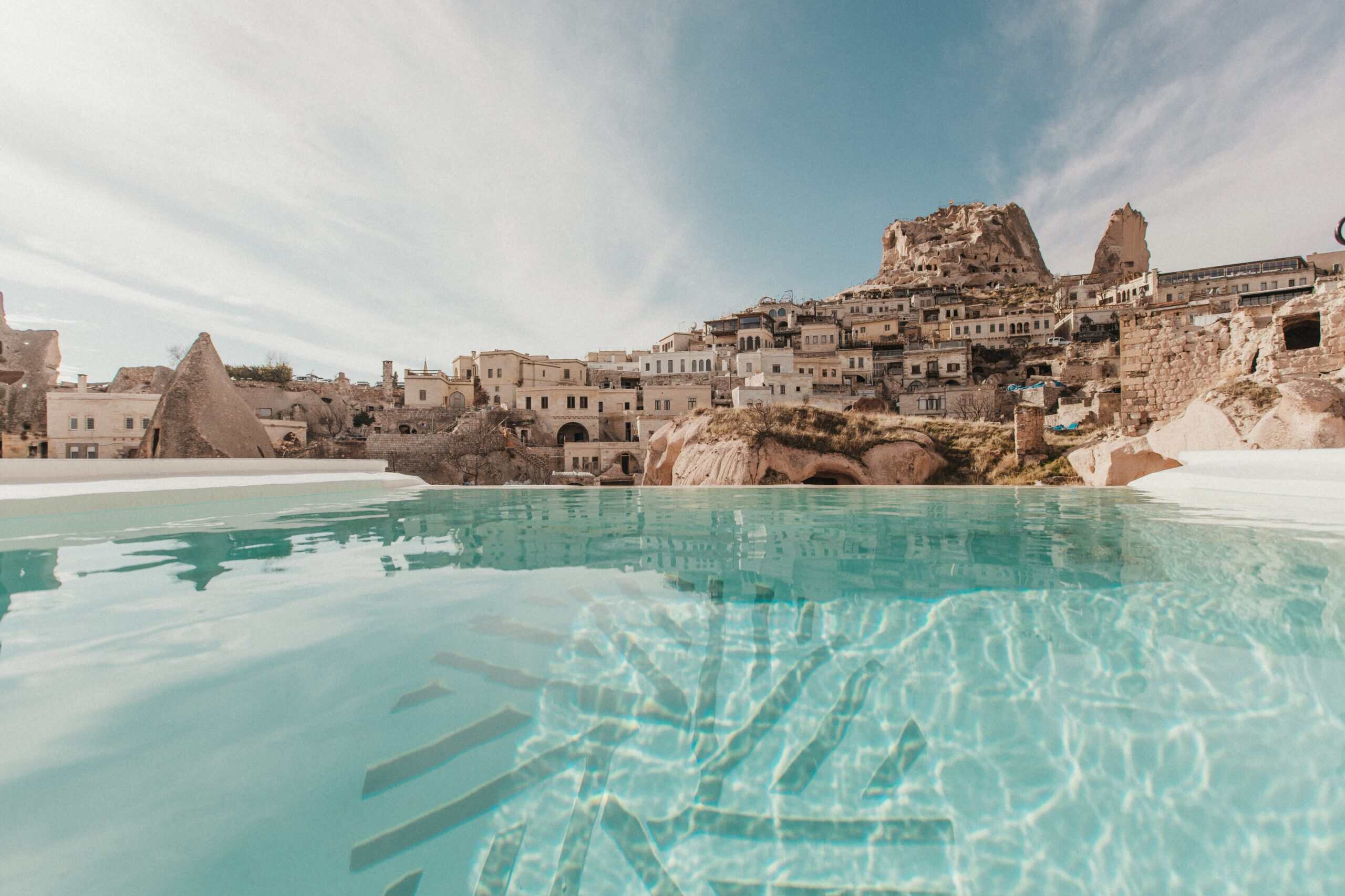 Outdoor pool with a view of Uçhisar Castle at the Millstone Cave Suite, a suite featuring a pool with a view.