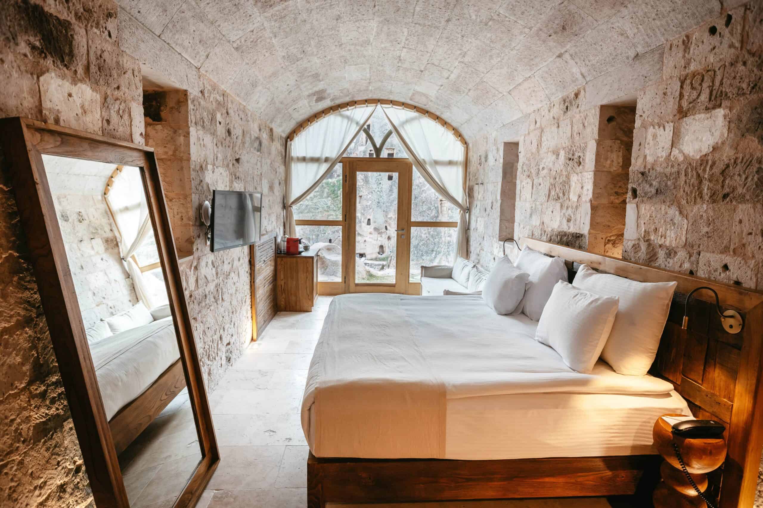 Junior suite with a view at Millstone Cave Suite, featuring a Jacuzzi and a view of the fairy chimneys.