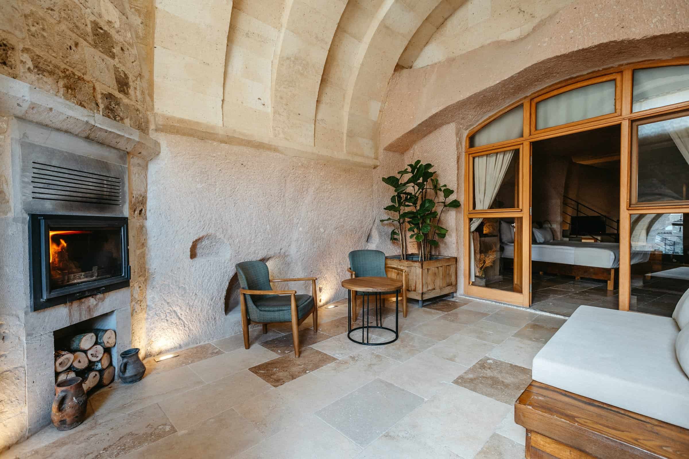 Millstone Cave Suites superior king suite features a cave room with a fireplace.