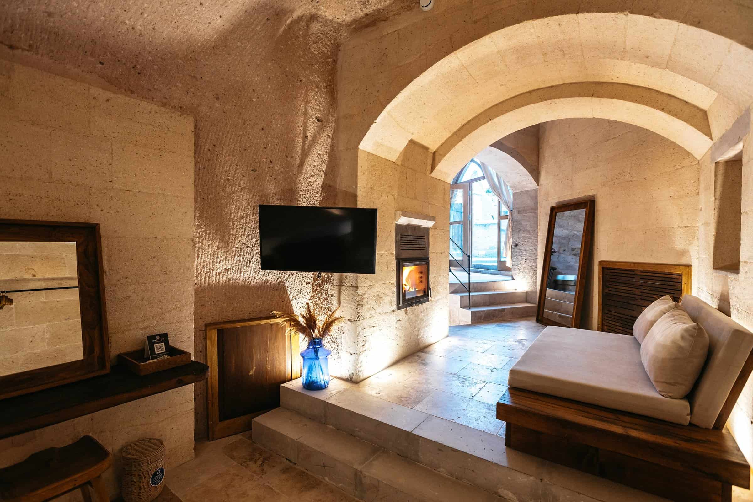Cave room with indoor pool and fireplace in the Pool Suite at Millstone Cave Suites