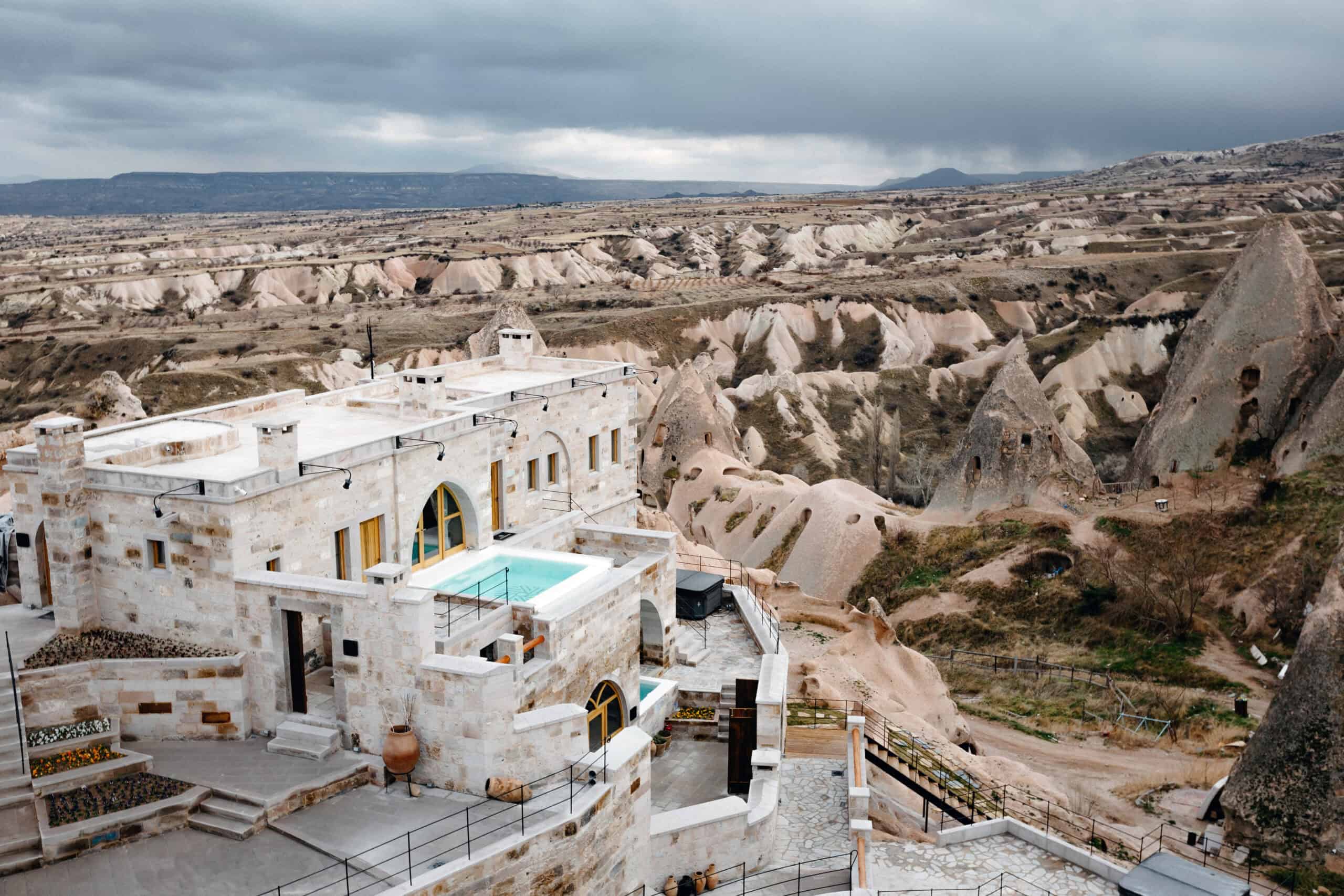 Millstone Cave Suites, a cave hotel with views of the fairy chimneys and Uçhisar Castle.